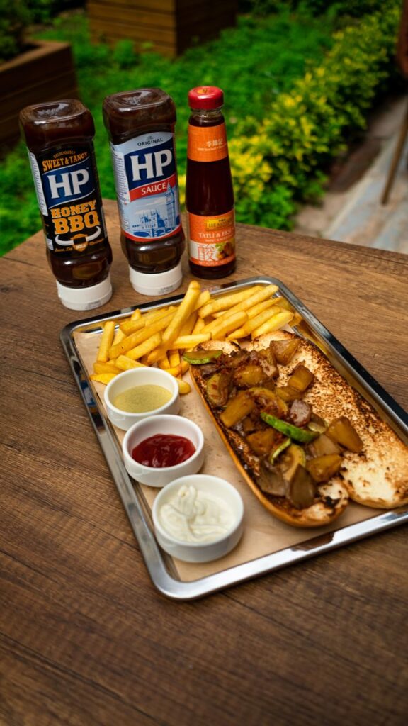 A tempting platter with fries and sauces on a wooden table, perfect for a tasty snack.